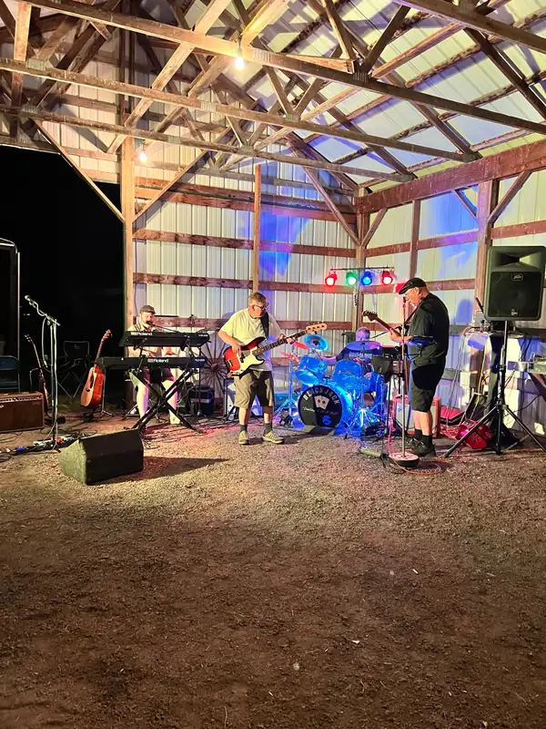The Blackjack Band playing live under the lit pavilion